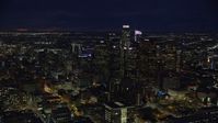 7.6K stock footage aerial video of group of skyscrapers at night in Downtown Los Angeles, California Aerial Stock Footage | AX0158_097