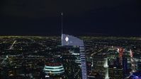 7.6K stock footage aerial video orbiting the top of the Wilshire Grand Center tower at night, Downtown Los Angeles, California Aerial Stock Footage | AX0158_115