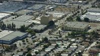 7.6K stock footage aerial video flying over warehouses in Sylmar industrial area, San Fernando Valley, California Aerial Stock Footage | AX0159_006