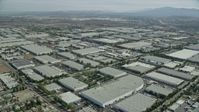 7.6K stock footage aerial video flying over numerous large warehouses in Chino, California Aerial Stock Footage | AX0159_137