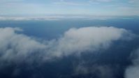 7.6K stock footage aerial video flying over low level clouds over the Pacific Ocean off the coast of Southern California Aerial Stock Footage | AX0160_022