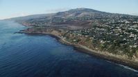 7.6K stock footage aerial video tilting from kelp in the ocean to reveal coastal cliffs and neighborhoods in San Pedro, California Aerial Stock Footage | AX0161_017