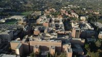 7.6K stock footage aerial video orbiting College university campus buildings in Los Angeles, California Aerial Stock Footage | AX0161_093