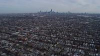 4K stock footage aerial video of flying over West Side suburban neighborhoods toward Downtown Chicago, Illinois skyline Aerial Stock Footage | AX0165_0015