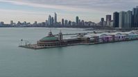 4K stock footage aerial video of circling around Navy Pier to reveal Downtown Chicago skyline, Illinois Aerial Stock Footage | AX0165_0069
