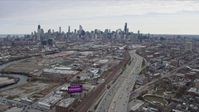 4K stock footage aerial video of following light freeway traffic and the river toward the Downtown Chicago skyline, Chicago, Illinois Aerial Stock Footage | AX0167_0082