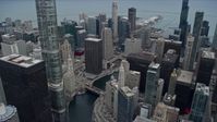 4K stock footage aerial video of waterfront skyscrapers by the Chicago River, Downtown Chicago, Illinois Aerial Stock Footage | AX0167_0099