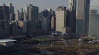 4K stock footage aerial video ascend from lake to reveal iconic landmarks in Grant Park, Downtown Chicago, Illinois Aerial Stock Footage | AX0169_0039