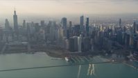 4K stock footage aerial video of flying past Downtown Chicago, Illinois, seen from Lake Michigan Aerial Stock Footage | AX0169_0100