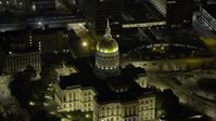 6.7K stock footage aerial video of flying away from the Georgia State Capitol Building at night in Downtown Atlanta, Georgia Aerial Stock Footage | AX0171_0206