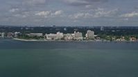 6.7K stock footage aerial video of approaching a waterfront hospital in Miami, Florida Aerial Stock Footage | AX0172_003