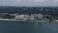6.7K stock footage aerial video of flying by a waterfront hospital in Miami, Florida Aerial Stock Footage | AX0172_007
