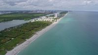 6.7K stock footage aerial video of following the beach toward coastal homes in Hollywood, Florida Aerial Stock Footage | AX0172_037