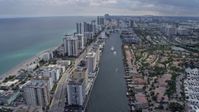 6.7K stock footage aerial video tilt from canal to reveal and pass condos in Hollywood, Florida Aerial Stock Footage | AX0172_070