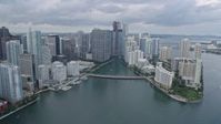 6.7K stock footage aerial video fly over Brickell Key, pan to reveal Miami River in Downtown Miami, Florida Aerial Stock Footage | AX0172_086