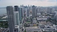6.7K stock footage aerial video tilt from freeway by performing arts center, reveal skyscrapers in Downtown Miami, Florida Aerial Stock Footage | AX0172_088