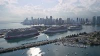 6.7K stock footage aerial video of cruise ships at the port and the skyline of Downtown Miami, Florida Aerial Stock Footage | AX0172_123