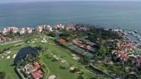 6.7K stock footage aerial video of flying over the golf course of Fisher Island near oceanfront condo complexes, Miami, Florida Aerial Stock Footage | AX0172_127