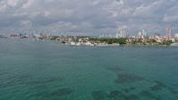 6.7K stock footage aerial video of approaching Fisher Island's oceanfront condo complexes, Miami, Florida Aerial Stock Footage | AX0172_128