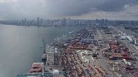 6.7K stock footage aerial video of flying over Port of Miami to approach Downtown Miami, Florida Aerial Stock Footage | AX0172_146