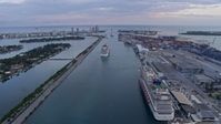 6.7K stock footage aerial video of cruise ships sailing out of Biscayne Bay at sunset, Miami, Florida Aerial Stock Footage | AX0172_167