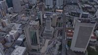 6.7K stock footage aerial video reverse view of courthouse and high-rise apartment buildings at sunset, Miami, Florida Aerial Stock Footage | AX0172_183