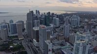 6.7K stock footage aerial video of flying past Downtown Miami skyscrapers at sunset, Miami, Florida Aerial Stock Footage | AX0172_185