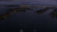 6.7K stock footage aerial video of approaching the Venetian Island at twilight, Miami, Florida Aerial Stock Footage | AX0172_215