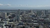 6K stock footage aerial video of flying past downtown office buildings in Oakland, California Aerial Stock Footage | AX0173_0024