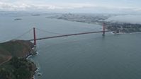 6K stock footage aerial video of flying over fog above Marin Headlands, reveal Golden Gate Bridge, California Aerial Stock Footage | AX0173_0100