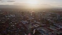 6K stock footage aerial video of passing by Downtown San Jose at sunset, California Aerial Stock Footage | AX0174_0024