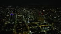6K stock footage aerial video of flying by office buildings in Downtown Oakland at night, California Aerial Stock Footage | AX0174_0130