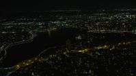 6K stock footage aerial video of Lake Merritt near Downtown Oakland at night, California Aerial Stock Footage | AX0174_0133