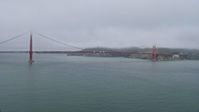 6K stock footage aerial video of flying by the Golden Gate Bridge on a foggy day, San Francisco, California Aerial Stock Footage | AX0175_0029