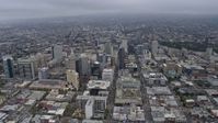 6K stock footage aerial video passing office buildings in Downtown Oakland on a foggy day, California Aerial Stock Footage | AX0175_0087
