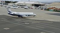 6K stock footage aerial video of a private jet at Oakland Airport, California Aerial Stock Footage | AX0175_0094