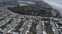 6K stock footage aerial video of flying over Outer Sunset District homes, tilt to shops, San Francisco, California Aerial Stock Footage | AX0175_0186