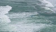 6K stock footage aerial video of a kite surfer on ocean waves near the Outer Sunset District, San Francisco, California Aerial Stock Footage | AX0175_0190