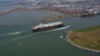 6K stock footage aerial video of a cargo ship and escort sailing near the Port of Oakland, California Aerial Stock Footage | AX0175_0216