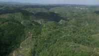 4.8K stock footage aerial video of tree covered mountains and jungle, Karst Forest, Puerto Rico Aerial Stock Footage | AX101_050