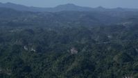 4.8K stock footage aerial video Flying over lush green forests and limestone cliffs, Karst Forest, Puerto Rico Aerial Stock Footage | AX101_089