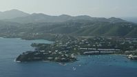 4.8K stock footage aerial video of Homes nestled in trees around Caribbean blue waters of the bay, East End, St Thomas Aerial Stock Footage | AX103_063