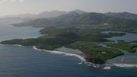 4.8K stock footage aerial video of Tiny islands in sapphire blue Caribbean waters along the shores, East End, St Thomas Aerial Stock Footage | AX103_065