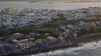 4.8K stock footage aerial video of Oceanfront Caribbean homes, Old San Juan, Puerto Rico, sunset Aerial Stock Footage | AX104_003