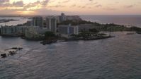 4.8K stock footage aerial video of the Oceanfront Caribe Hilton Hotel, Normandie Hotel, San Juan, Puerto Rico, sunset Aerial Stock Footage | AX104_072