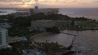 4.8K stock footage aerial video of the Oceanfront Normandie Hotel and Estadio Sixto Escobar, San Juan Puerto Rico, sunset Aerial Stock Footage | AX104_073