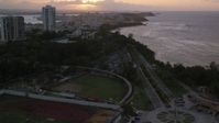 4.8K stock footage aerial video of Beachfront, oceanfront buildings, Old San Juan, Puerto Rico, sunset Aerial Stock Footage | AX104_074