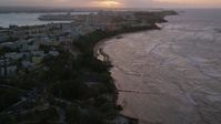 4.8K stock footage aerial video of Caribbean buildings near the beach and ocean, Old San Juan, Puerto Rico, sunset Aerial Stock Footage | AX104_075