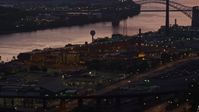 4K stock footage aerial video of Western State Penitentiary along the river, Pittsburgh, Pennsylvania, twilight Aerial Stock Footage | AX108_155