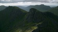 5.5K stock footage aerial video of The Cobbler, a green peak, Scottish Highlands, Scotland Aerial Stock Footage | AX110_075